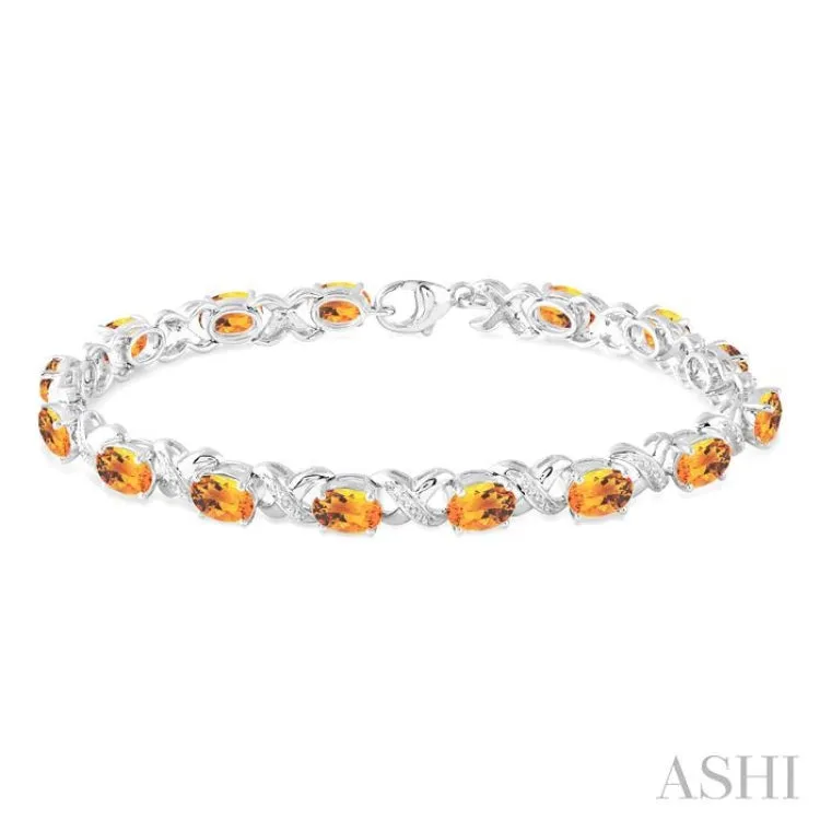 7x5 mm Oval Cut Citrine and 1/20 Ctw Round Cut Diamond Fashion Bracelet in Sterling Silver