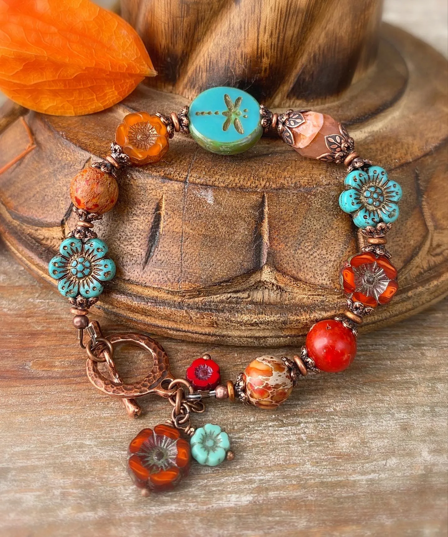 Flower Czech glass in turquoise, orange jasper, agate, copper metal bracelet.