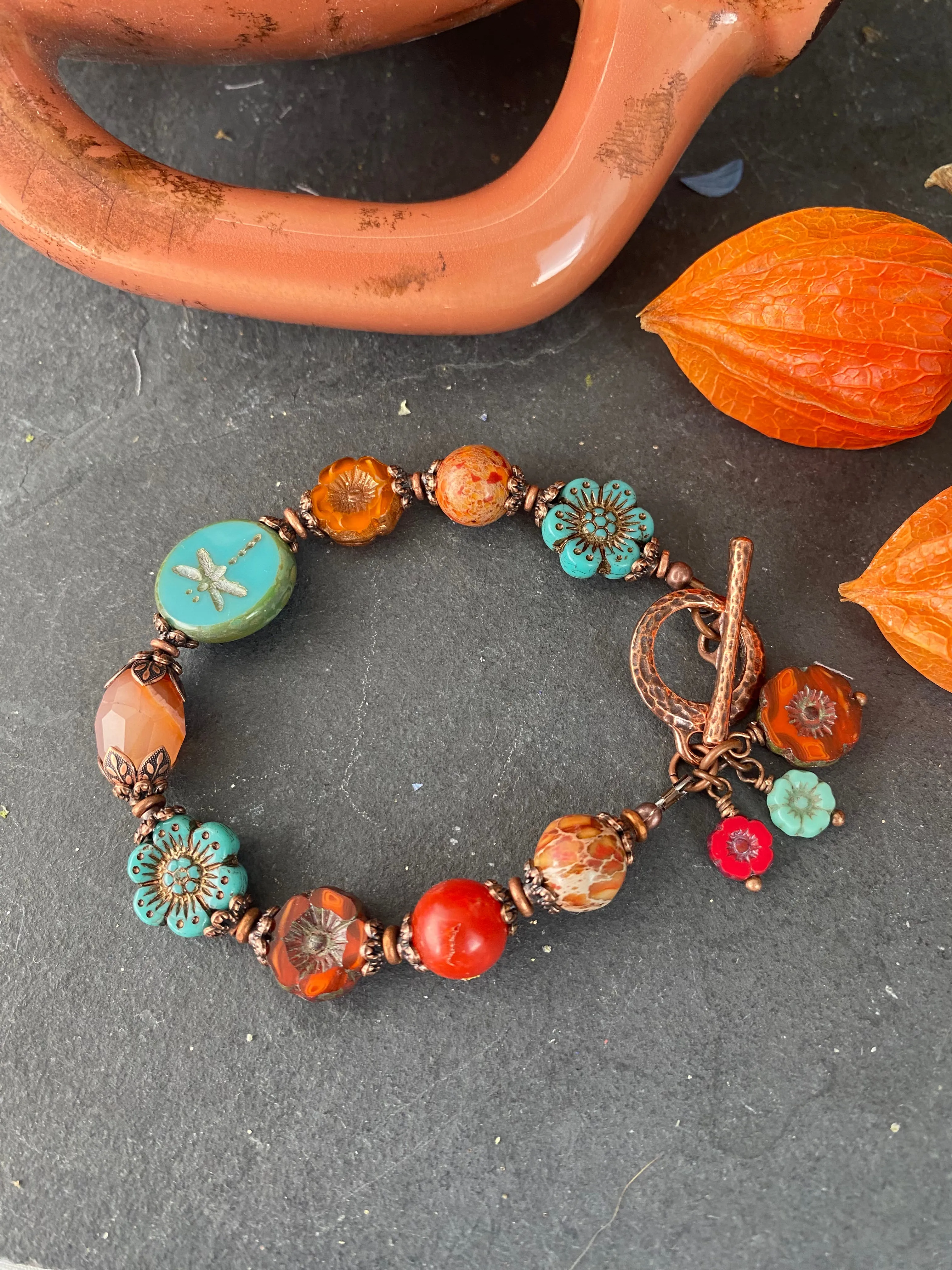 Flower Czech glass in turquoise, orange jasper, agate, copper metal bracelet.