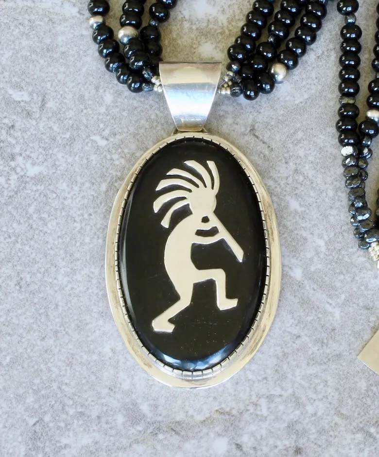 Indonesian Palmwood and Sterling Silver Kokopelli Pendant with 3 Strands of Onyx Rondelles, Vintage Czech Nailheads, Oxidized Sterling Silver Rounds and a Sterling Silver Toggle Clasp