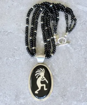 Indonesian Palmwood and Sterling Silver Kokopelli Pendant with 3 Strands of Onyx Rondelles, Vintage Czech Nailheads, Oxidized Sterling Silver Rounds and a Sterling Silver Toggle Clasp