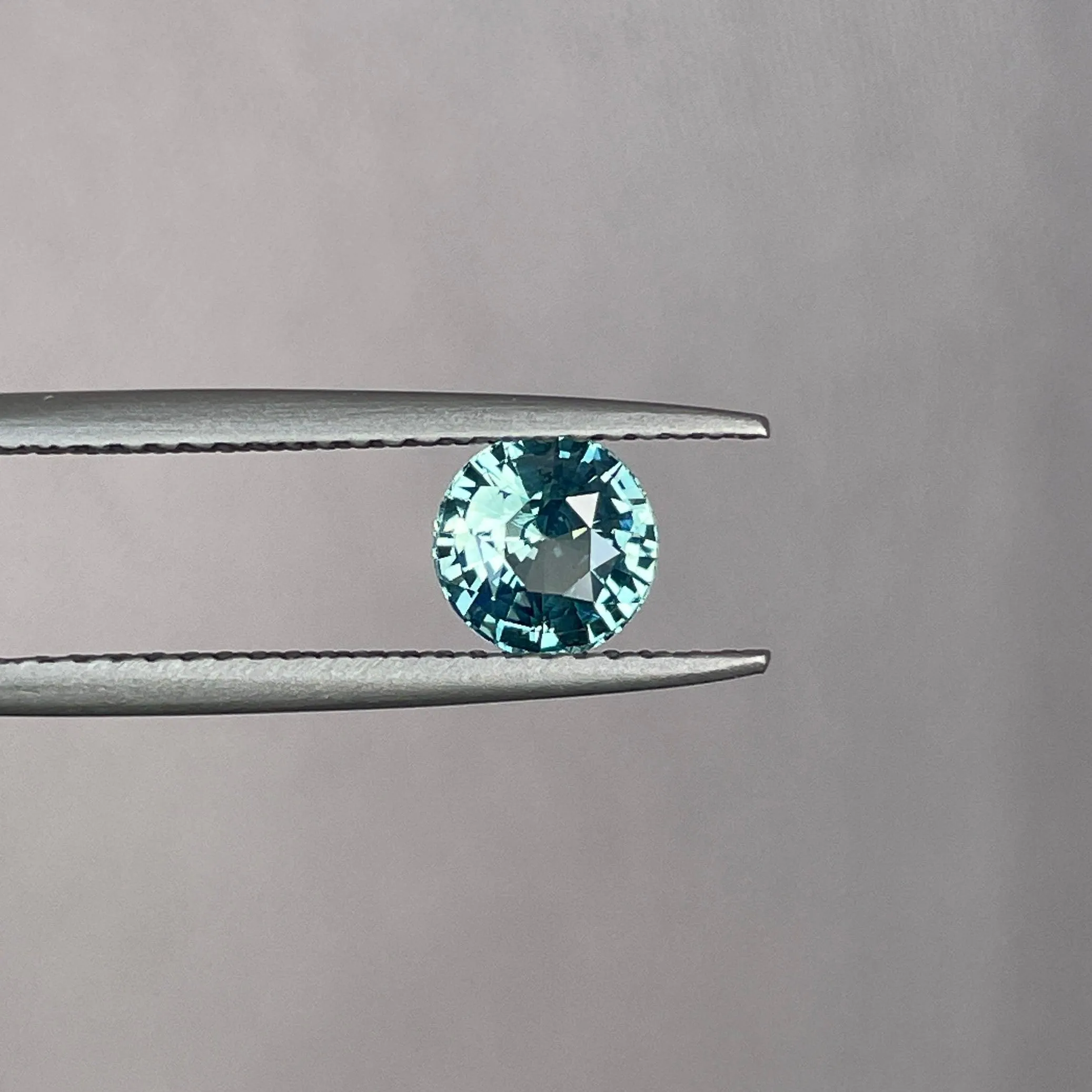 This 0.96 crt Teal Sapphire is well cut to bring out the best colour and lustre, and has a perfect colour blend.